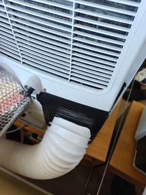 Intake hose attached with tape, wider view (Inventor Magic M2GHP290-12 / anon / 2026 / 06)