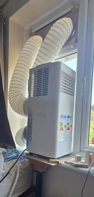AC after conversion, front view with hoses out window (Kingfisher WAP31A15E / Patrick / 2026 / 07)