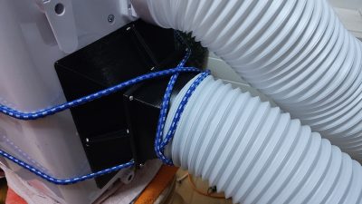 Cowl fitted to the rear of the unit, with hose attached (TRONIC TLK 7000 C2 / Rein / 2026 / 08)